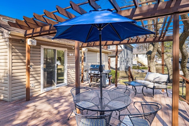 deck with outdoor dining space, a grill, and a pergola