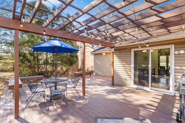 wooden deck with outdoor dining space and a pergola