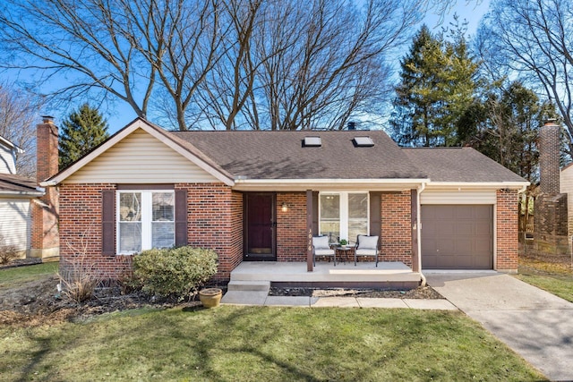 single story home with a front yard, a shingled roof, concrete driveway, a garage, and brick siding