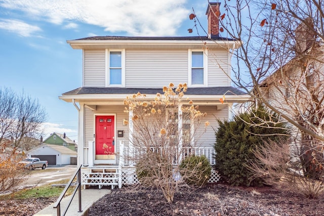 view of front of property featuring covered porch and a chimney