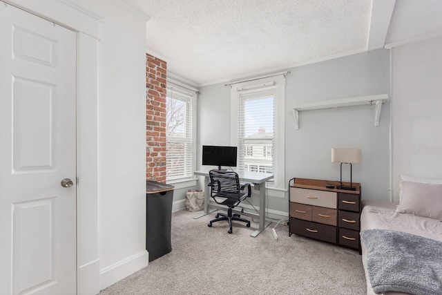 office area with baseboards, light carpet, a textured ceiling, and crown molding