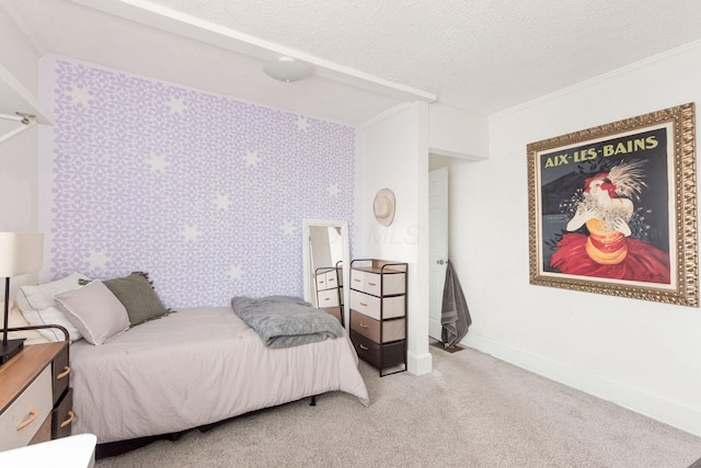 bedroom featuring ornamental molding, carpet, baseboards, and a textured ceiling