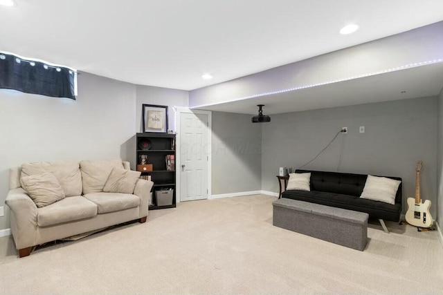 living room with recessed lighting, light colored carpet, and baseboards