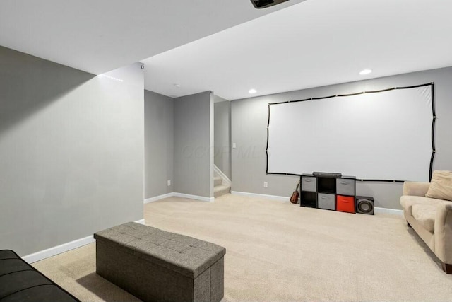 home theater featuring light carpet, recessed lighting, and baseboards