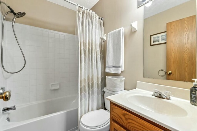 full bath with toilet, vanity, and shower / bath combo