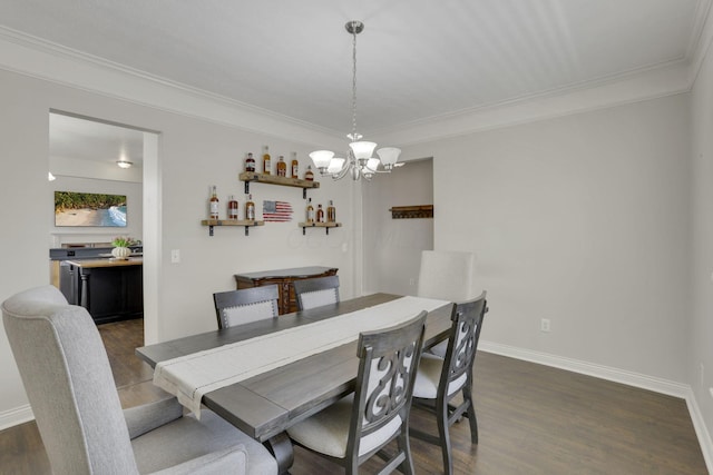 dining space featuring dark wood finished floors, crown molding, and baseboards