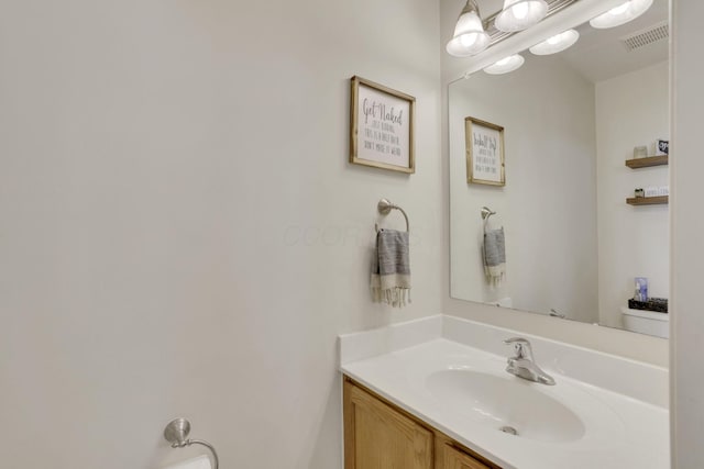 bathroom with vanity and visible vents