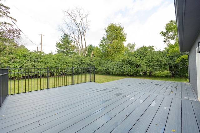 wooden deck with a yard