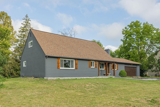 view of front of property with brick siding, an attached garage, a chimney, and a front yard