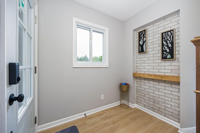 empty room featuring light wood-type flooring and baseboards