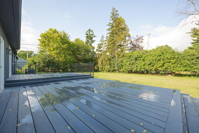 deck featuring a lawn and fence