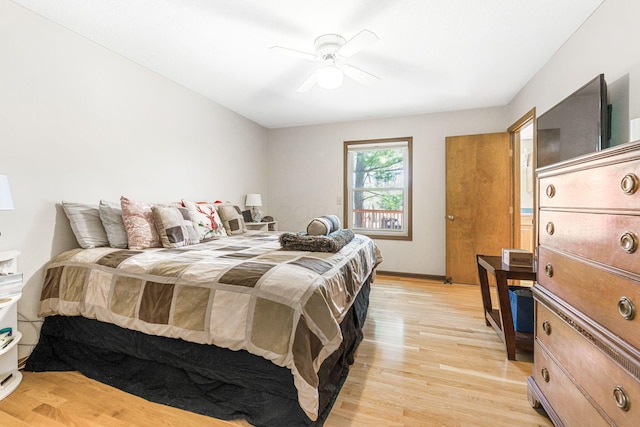 bedroom with light wood-style flooring and ceiling fan