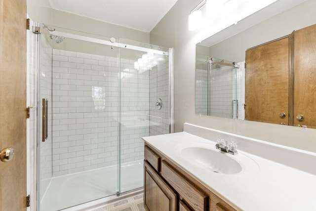 bathroom with vanity and a shower stall