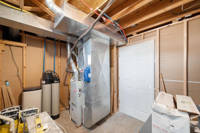 unfinished basement featuring heating unit