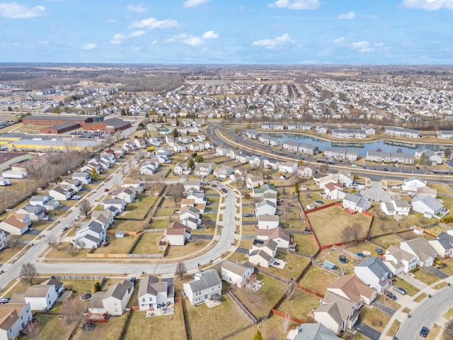 aerial view featuring a residential view and a water view