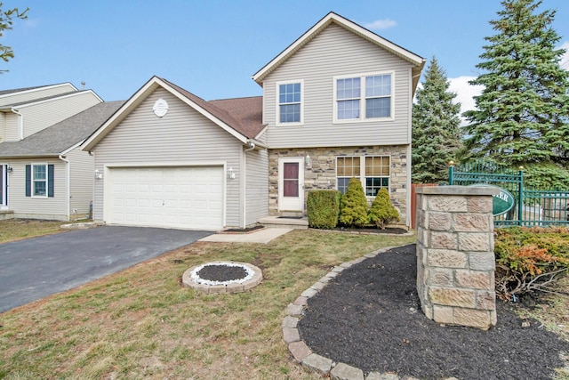 view of front facade featuring aphalt driveway, stone siding, fence, a front yard, and an attached garage