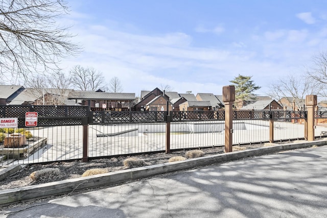 exterior space with a residential view and fence