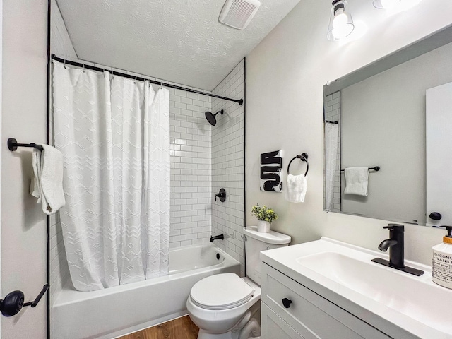 full bathroom with visible vents, toilet, shower / bath combo, a textured ceiling, and wood finished floors