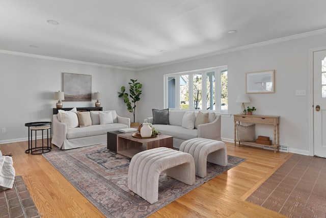 living room featuring wood finished floors, baseboards, and ornamental molding