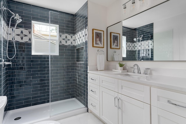 full bath with vanity and a stall shower