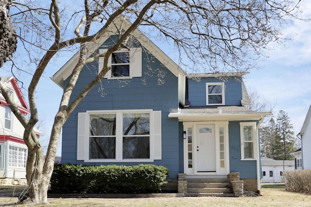 view of front of house with a shingled roof