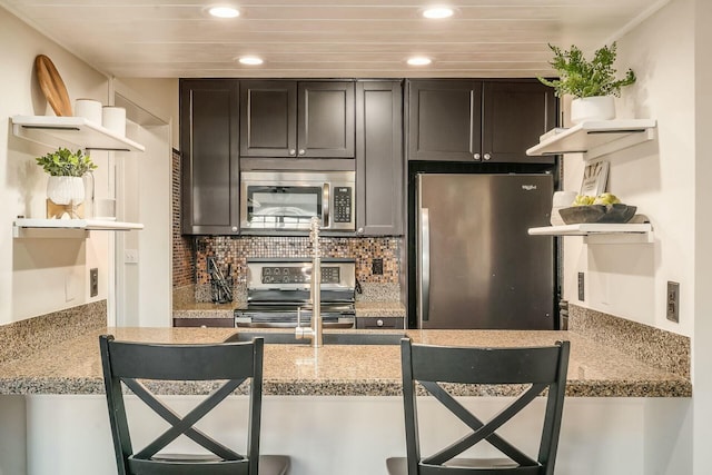 kitchen featuring open shelves, recessed lighting, tasteful backsplash, and appliances with stainless steel finishes