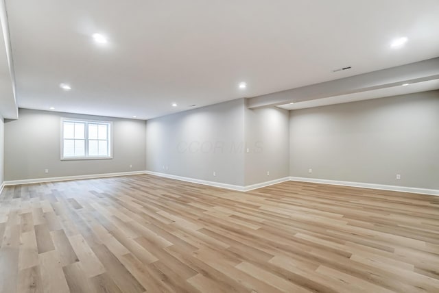 basement featuring visible vents, light wood-style flooring, recessed lighting, and baseboards