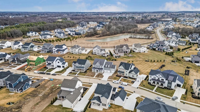 birds eye view of property with a residential view