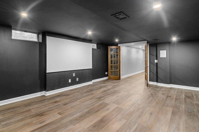 cinema featuring recessed lighting, visible vents, baseboards, and wood finished floors