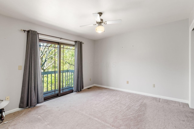 empty room with baseboards, carpet, and a ceiling fan