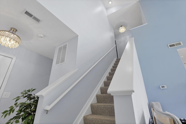 staircase featuring visible vents