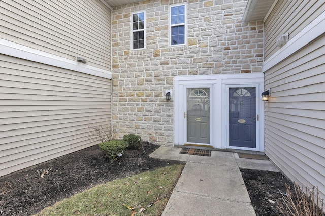 view of exterior entry with stone siding