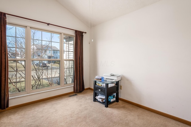 misc room with vaulted ceiling, carpet, visible vents, and baseboards