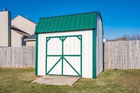 view of shed featuring fence