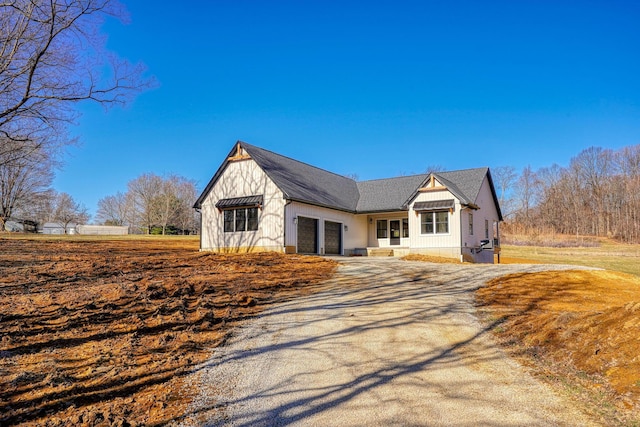 view of front of home with driveway and a garage