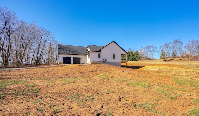 view of side of property featuring a garage