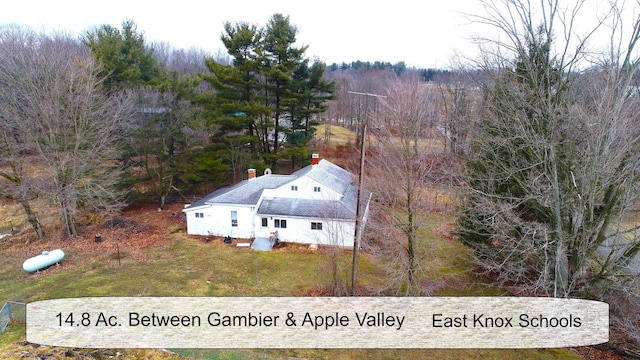 aerial view featuring a wooded view