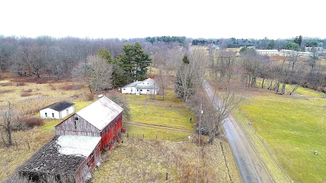 bird's eye view with a rural view and a wooded view