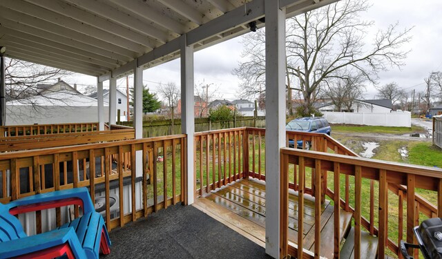 1151/1153 Heyl Ave, Columbus, OH 43206 - wooden terrace with fence, a lawn, and a residential view