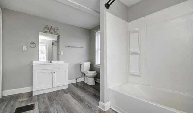 1151/1153 Heyl Ave, Columbus, OH 43206 - full bath with vanity, wood finished floors, visible vents, baseboards, and toilet