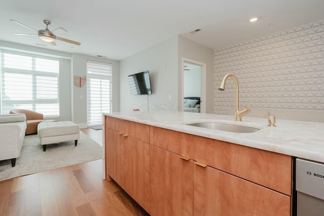 bathroom featuring visible vents, ensuite bathroom, wood finished floors, ceiling fan, and vanity