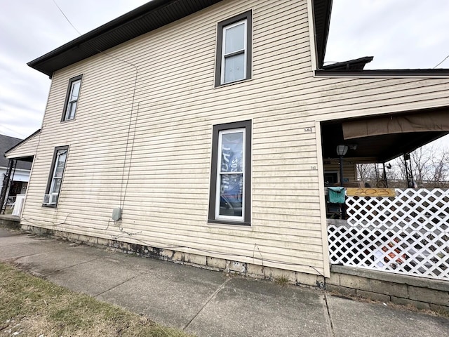 view of side of property with cooling unit