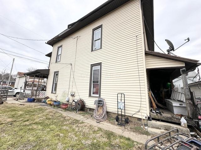 view of home's exterior with a yard