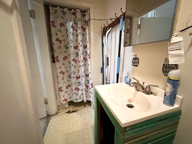 full bath with tile patterned floors, curtained shower, and vanity