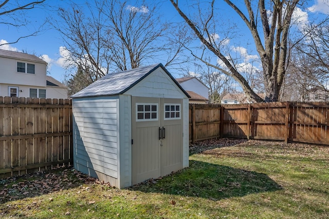 view of shed featuring a fenced backyard