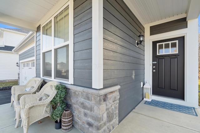 property entrance featuring covered porch