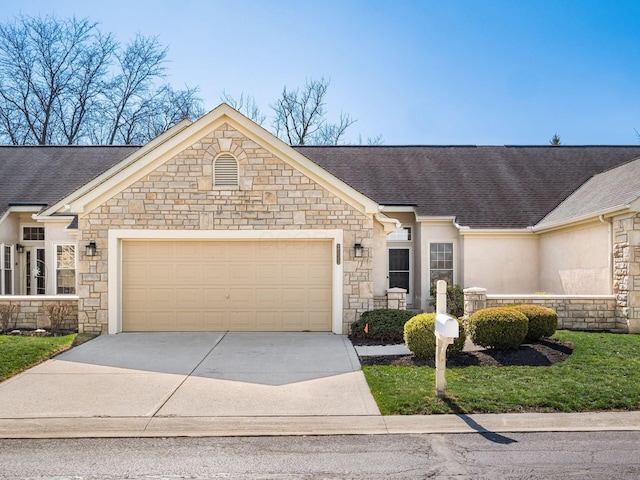 view of front of property featuring a garage, stone siding, driveway, and a shingled roof