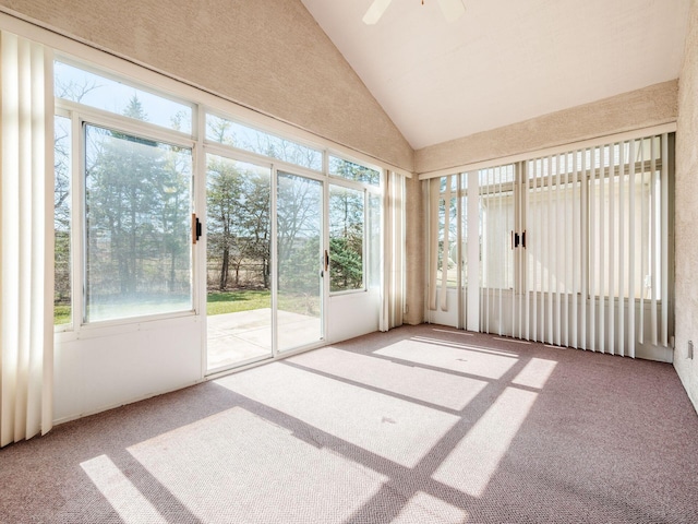 unfurnished sunroom featuring lofted ceiling and ceiling fan