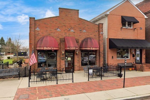 view of building exterior with fence