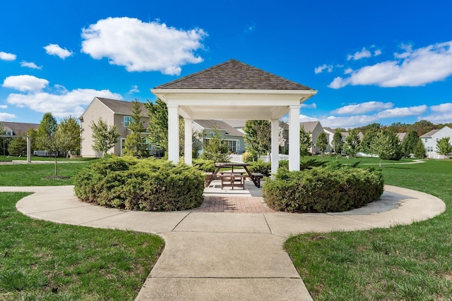 view of community with a gazebo, a residential view, and a yard